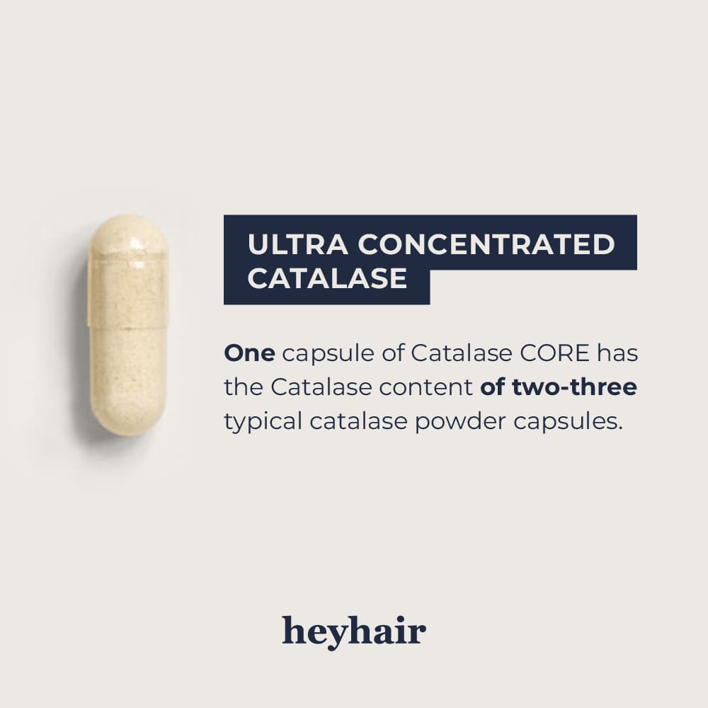 Man smiling and holding a supplement bottle while taking a pill.