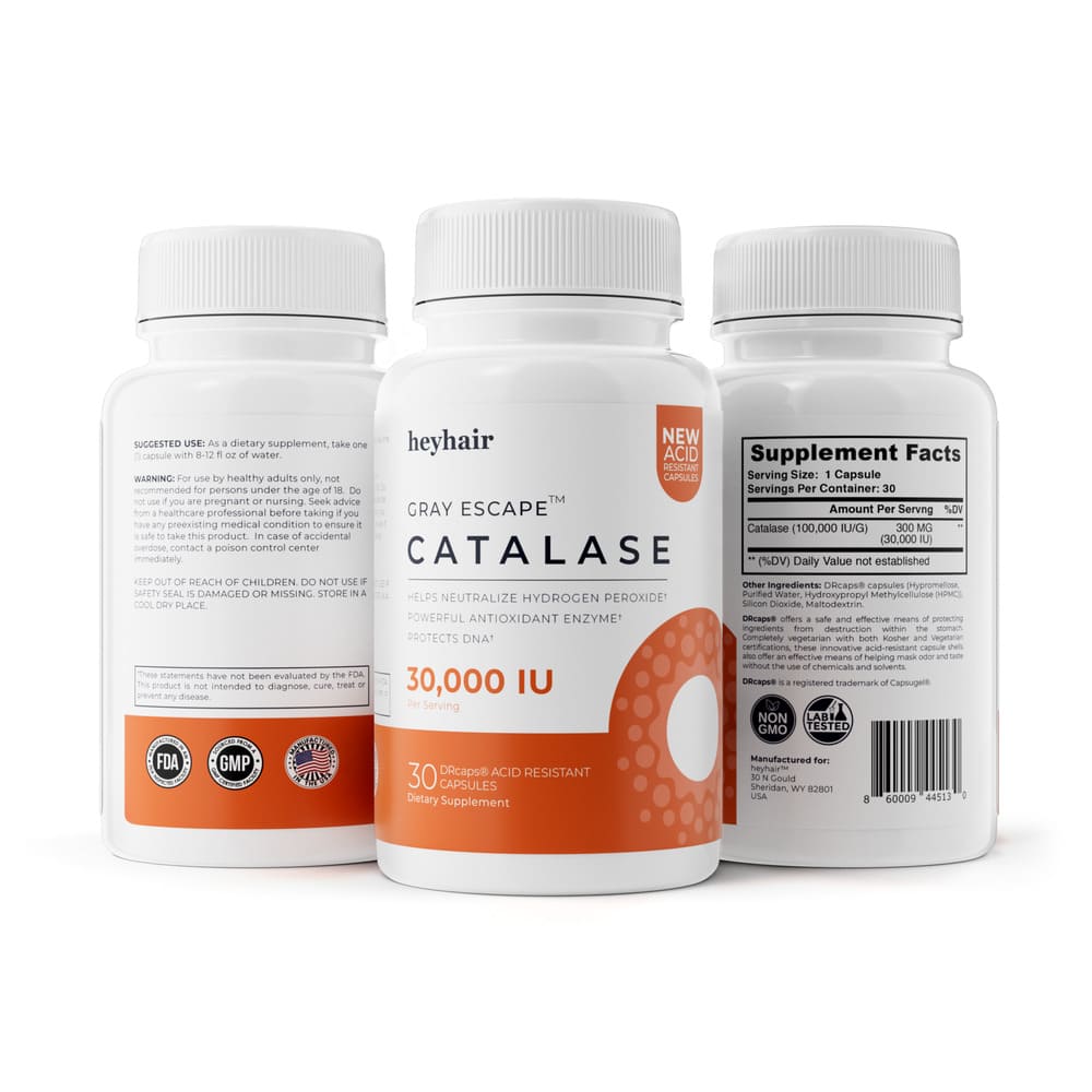 Man smiling and holding a supplement bottle while taking a pill.